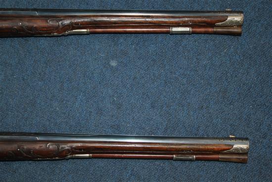 A pair of 18th century Bavarian flintlock holster pistols by Johann Jacob Kuchenreuter, overall length 21.5in.